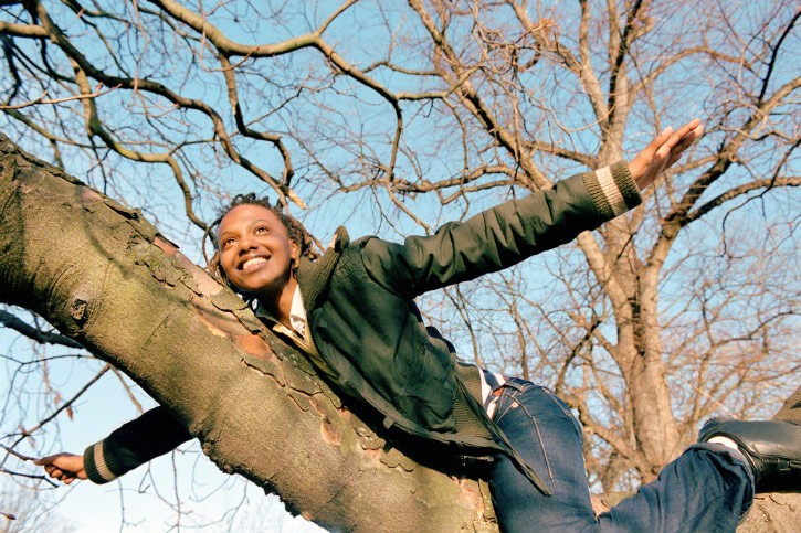 woman finds balance in tree